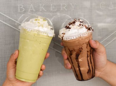 Two different cold beverages with whipped cream